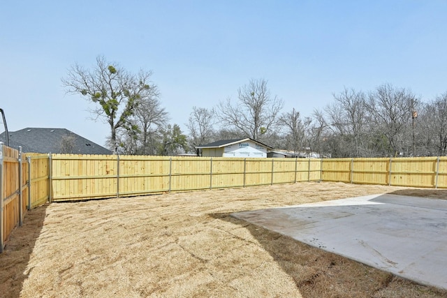 view of yard featuring a patio area and a fenced backyard