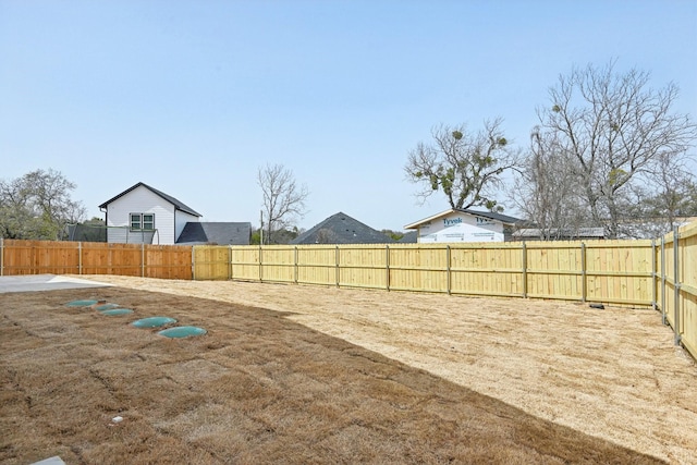 view of yard featuring a fenced backyard