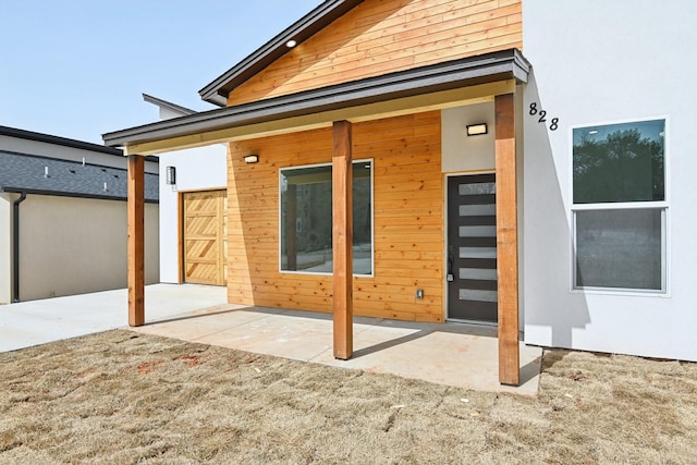 back of house with stucco siding