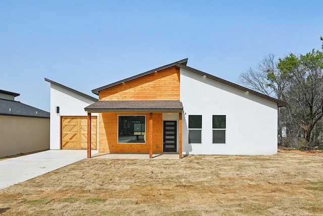 back of house featuring stucco siding