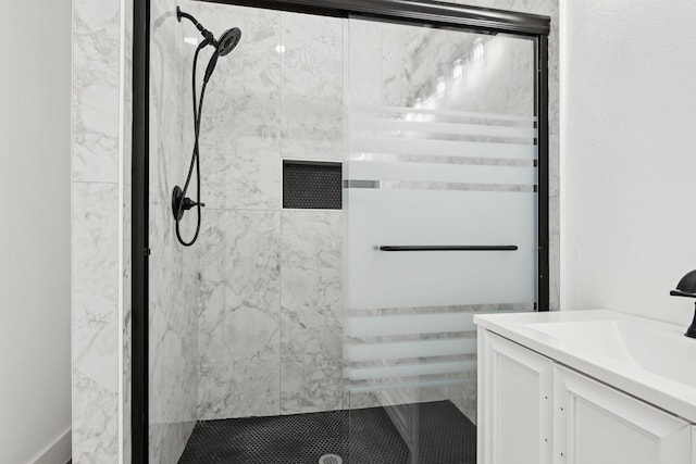 full bath featuring a shower stall and vanity