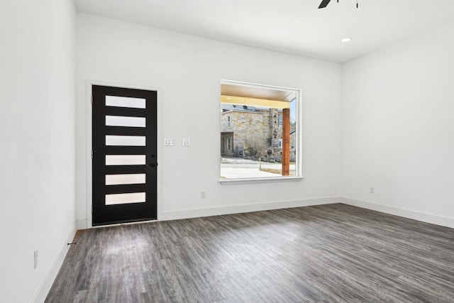 entryway featuring ceiling fan, baseboards, and wood finished floors