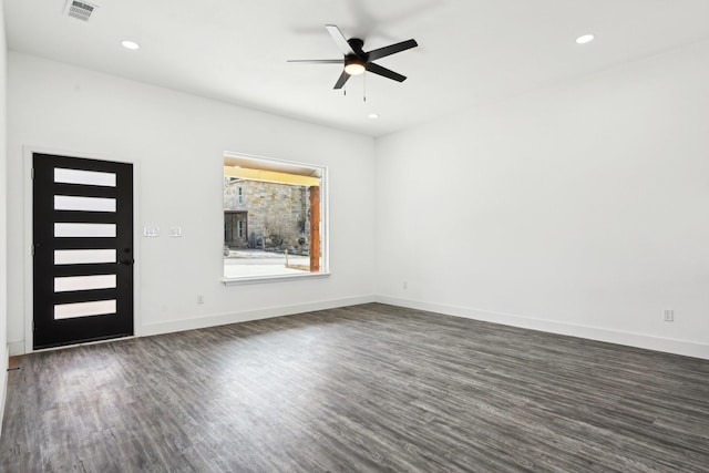 interior space with baseboards, visible vents, a ceiling fan, dark wood-type flooring, and recessed lighting