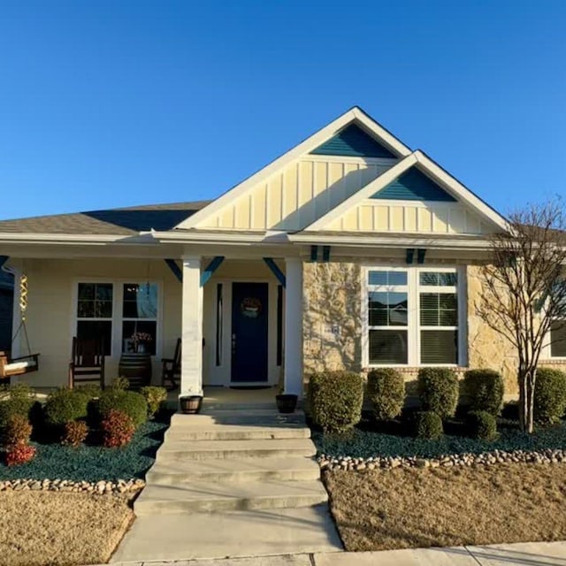 craftsman-style house with a porch and board and batten siding