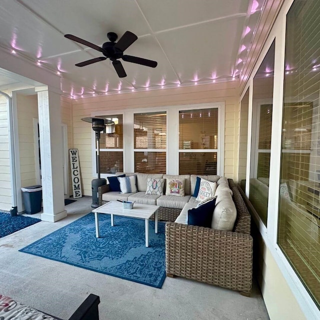 exterior space with ceiling fan and an outdoor hangout area