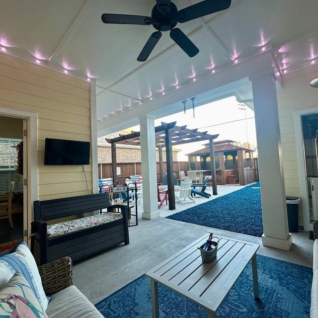 exterior space featuring an outdoor living space, fence, a ceiling fan, and a pergola