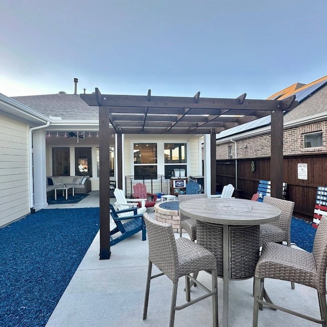 view of patio / terrace featuring fence, a pergola, and outdoor dining space