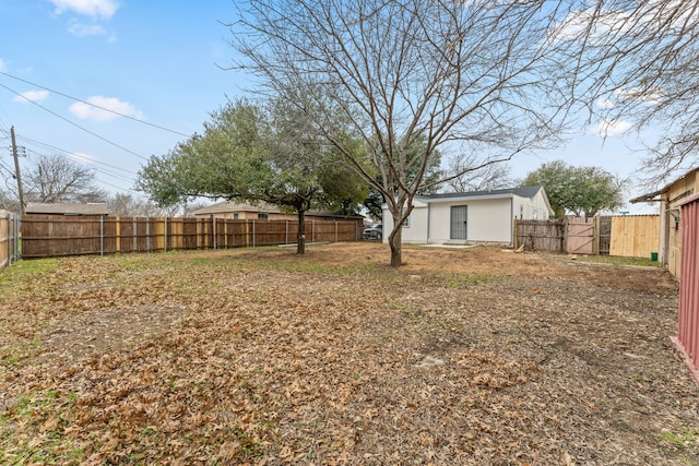 view of yard with a fenced backyard