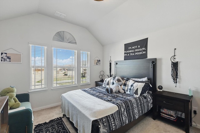 bedroom with visible vents, carpet floors, baseboards, and vaulted ceiling