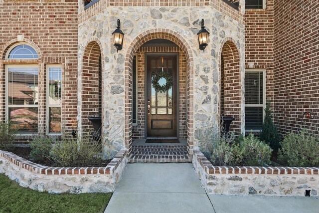 entryway with dark wood-style floors and baseboards