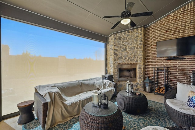 view of patio featuring an outdoor living space with a fireplace and ceiling fan