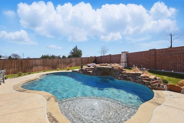 view of swimming pool with a jacuzzi, a fenced backyard, and a fenced in pool