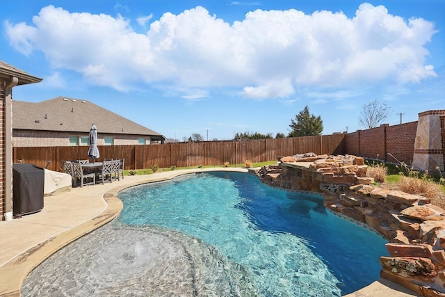 view of swimming pool with a fenced in pool, a patio, and a fenced backyard