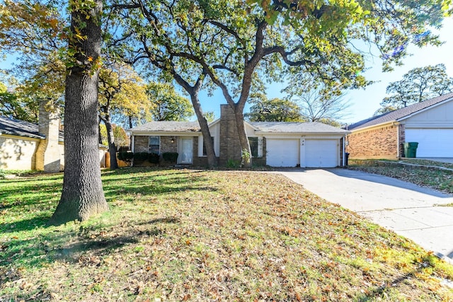 ranch-style house with an attached garage, driveway, and a front yard