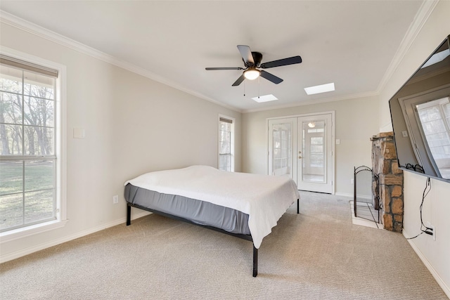 carpeted bedroom with baseboards, ceiling fan, ornamental molding, access to outside, and french doors