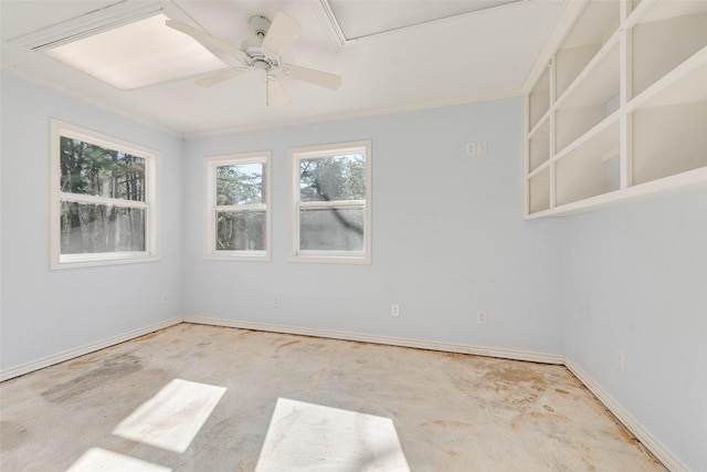 empty room with a ceiling fan, ornamental molding, and baseboards