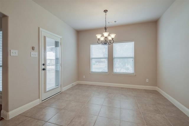 interior space featuring an inviting chandelier, baseboards, visible vents, and light tile patterned flooring