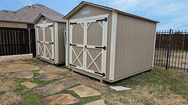 view of shed featuring a fenced backyard