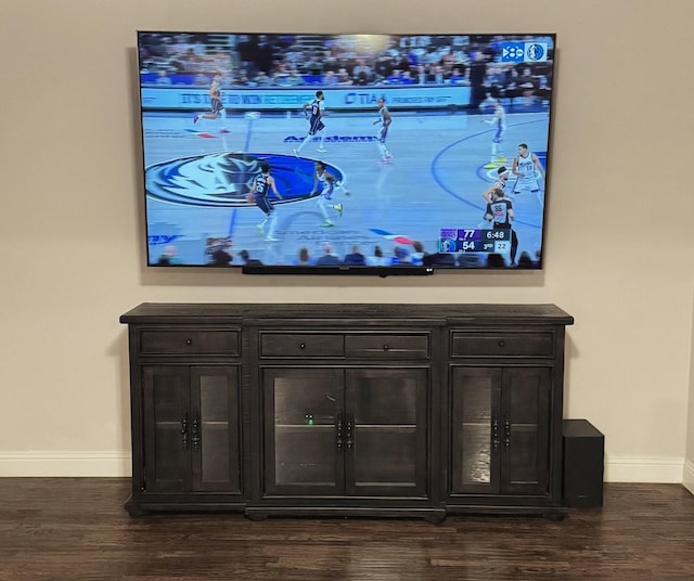 interior details featuring wood finished floors and baseboards