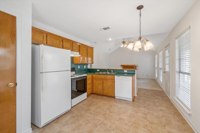 kitchen with under cabinet range hood, a peninsula, white appliances, a sink, and pendant lighting