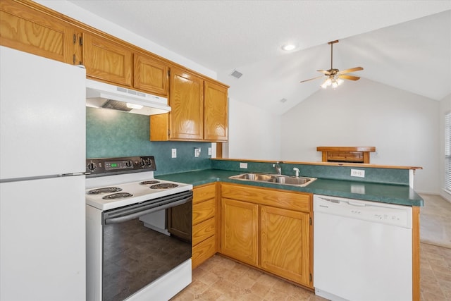 kitchen featuring white appliances, a peninsula, vaulted ceiling, under cabinet range hood, and a sink