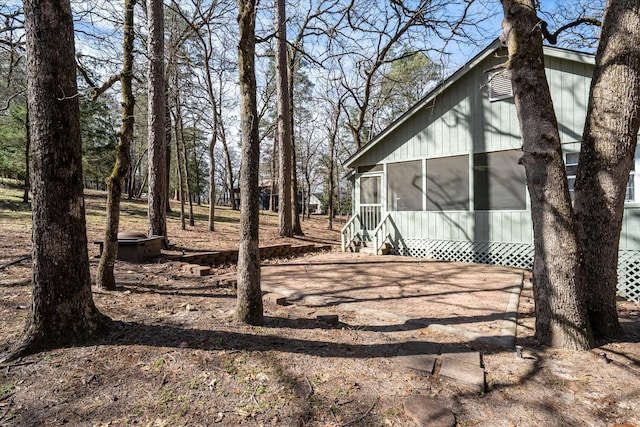 view of yard with a sunroom