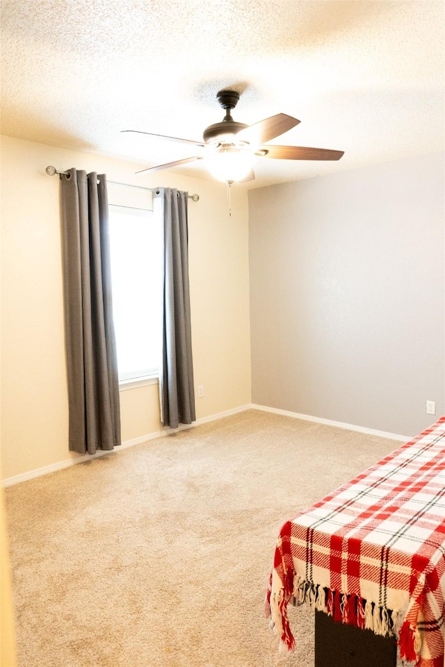 7409 Kingswood Dr, Fort Worth, TX 76133 - bedroom featuring a textured ceiling, carpet, a ceiling fan, and baseboards