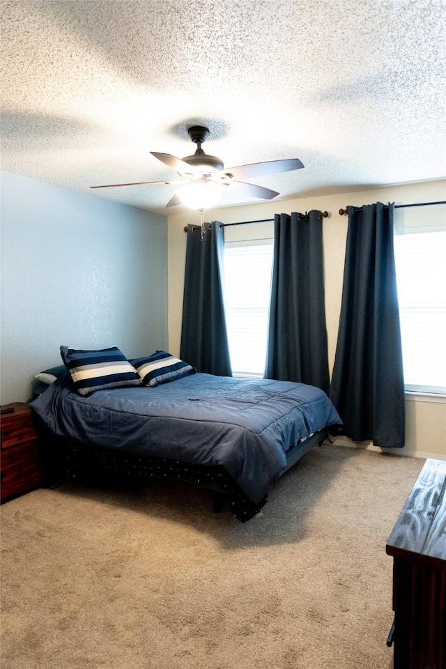 7409 Kingswood Dr, Fort Worth, TX 76133 - bedroom with carpet floors, ceiling fan, and a textured ceiling