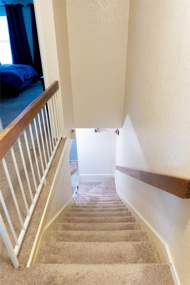 7409 Kingswood Dr, Fort Worth, TX 76133 - stairs featuring carpet, a textured wall, and baseboards