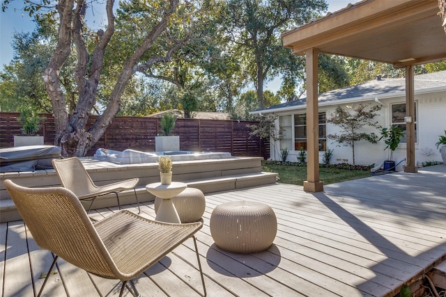 deck featuring outdoor dining area and fence