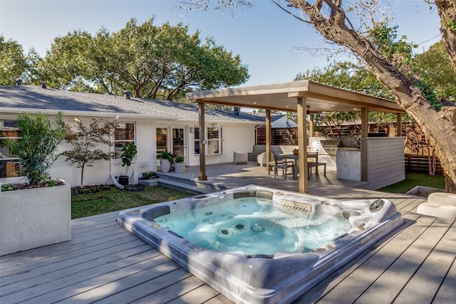 deck featuring hot tub deck surround