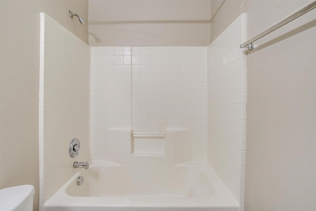 full bathroom featuring toilet and  shower combination