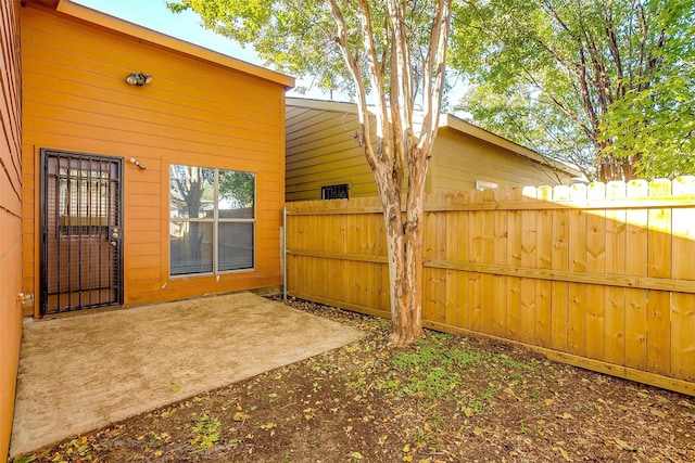 view of yard featuring a patio area and fence