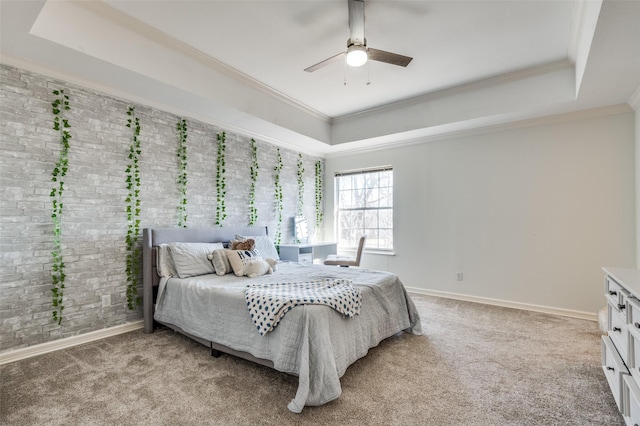 bedroom with light carpet, a raised ceiling, baseboards, and ornamental molding