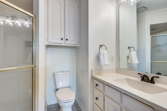 full bath featuring vanity, toilet, baseboards, and a stall shower