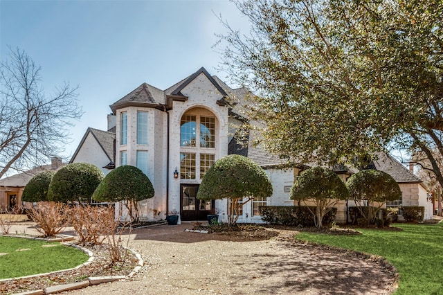 3605 Wexford Ct, Colleyville, TX 76034 - french country home with a front lawn and brick siding