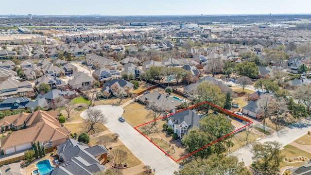 birds eye view of property with a residential view