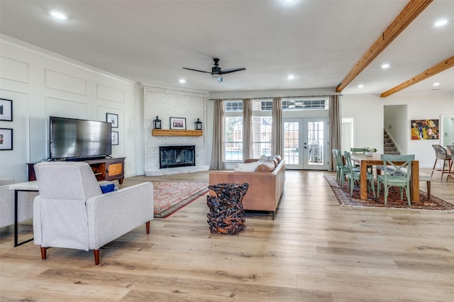 living area featuring light wood finished floors, french doors, recessed lighting, and ceiling fan
