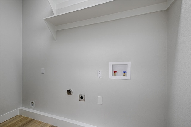 washroom featuring washer hookup, hookup for an electric dryer, wood finished floors, laundry area, and baseboards