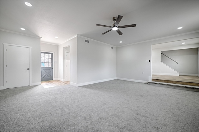 unfurnished living room with recessed lighting, carpet, visible vents, and baseboards