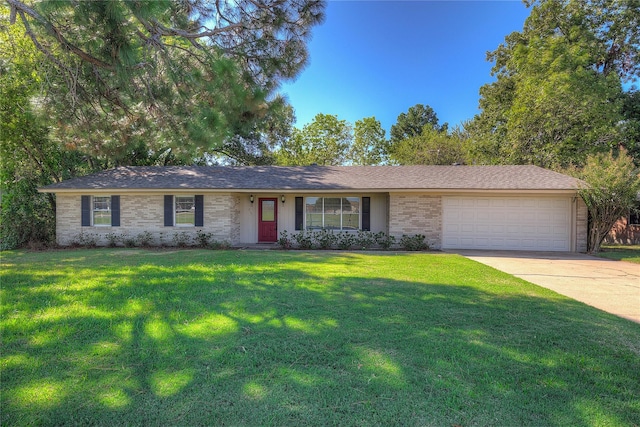 single story home with brick siding, a shingled roof, concrete driveway, a front yard, and a garage