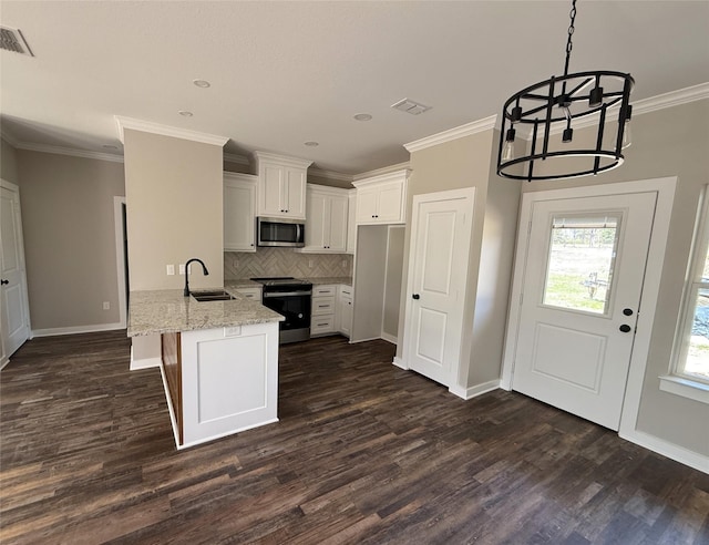 kitchen with white cabinets, a peninsula, a sink, stainless steel microwave, and electric range