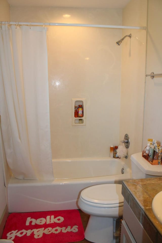 full bath featuring toilet, shower / bath combination with curtain, and vanity