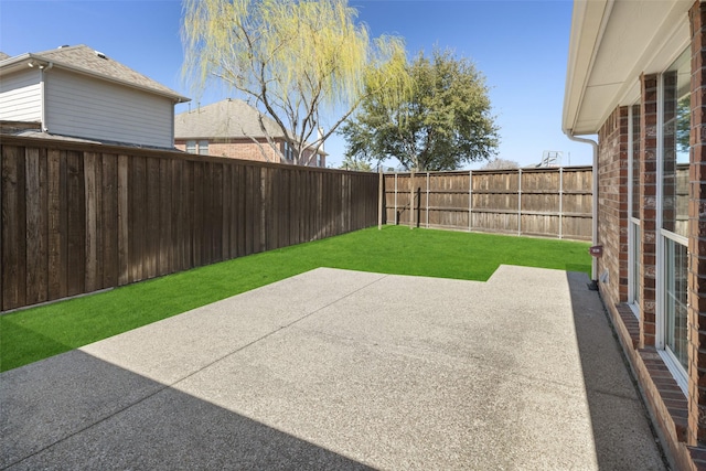 view of patio with a fenced backyard