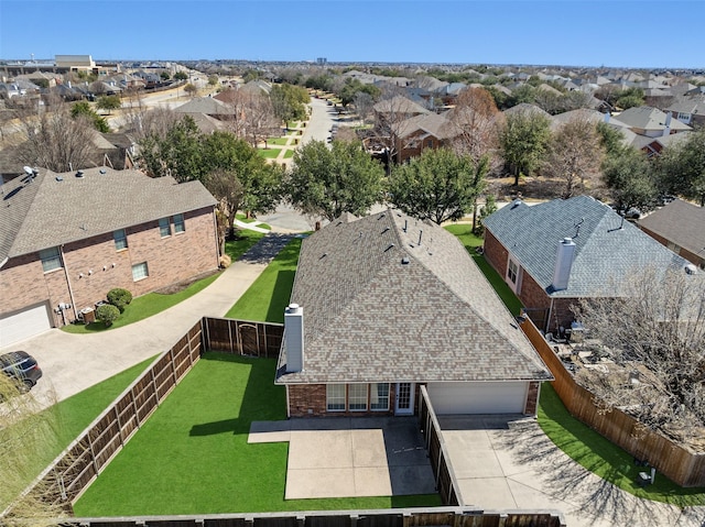 birds eye view of property with a residential view