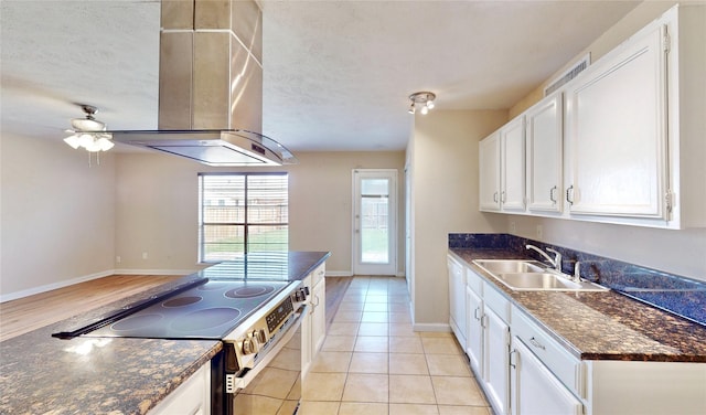 kitchen with island range hood, electric range, a sink, white cabinetry, and dark countertops