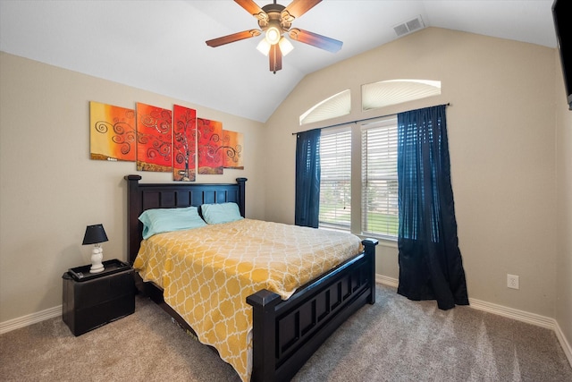 carpeted bedroom with lofted ceiling, baseboards, visible vents, and ceiling fan