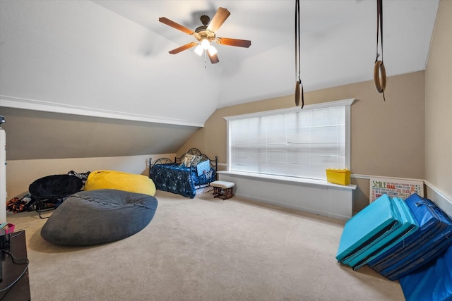 carpeted bedroom with lofted ceiling and a ceiling fan