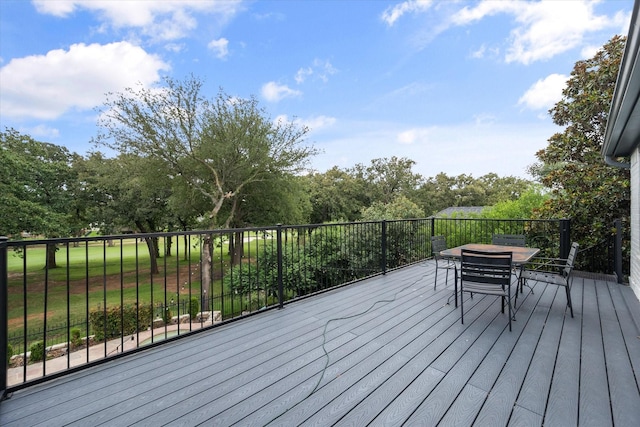 wooden deck with outdoor dining area