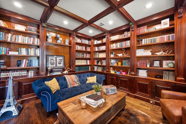 sitting room with coffered ceiling, visible vents, built in shelves, and wood finished floors